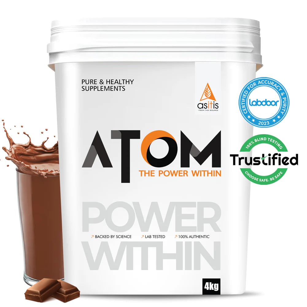 White supplement container labeled 'ATOM' with a glass of chocolate drink and chocolate pieces on a white background.