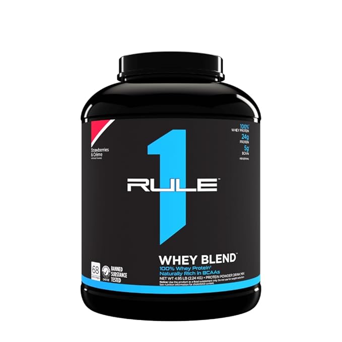 Black container of Rule 1 Whey Blend protein powder on a white background