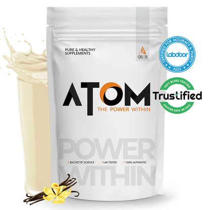 ATOM supplement package with vanilla beans and a splash of milk on a white background