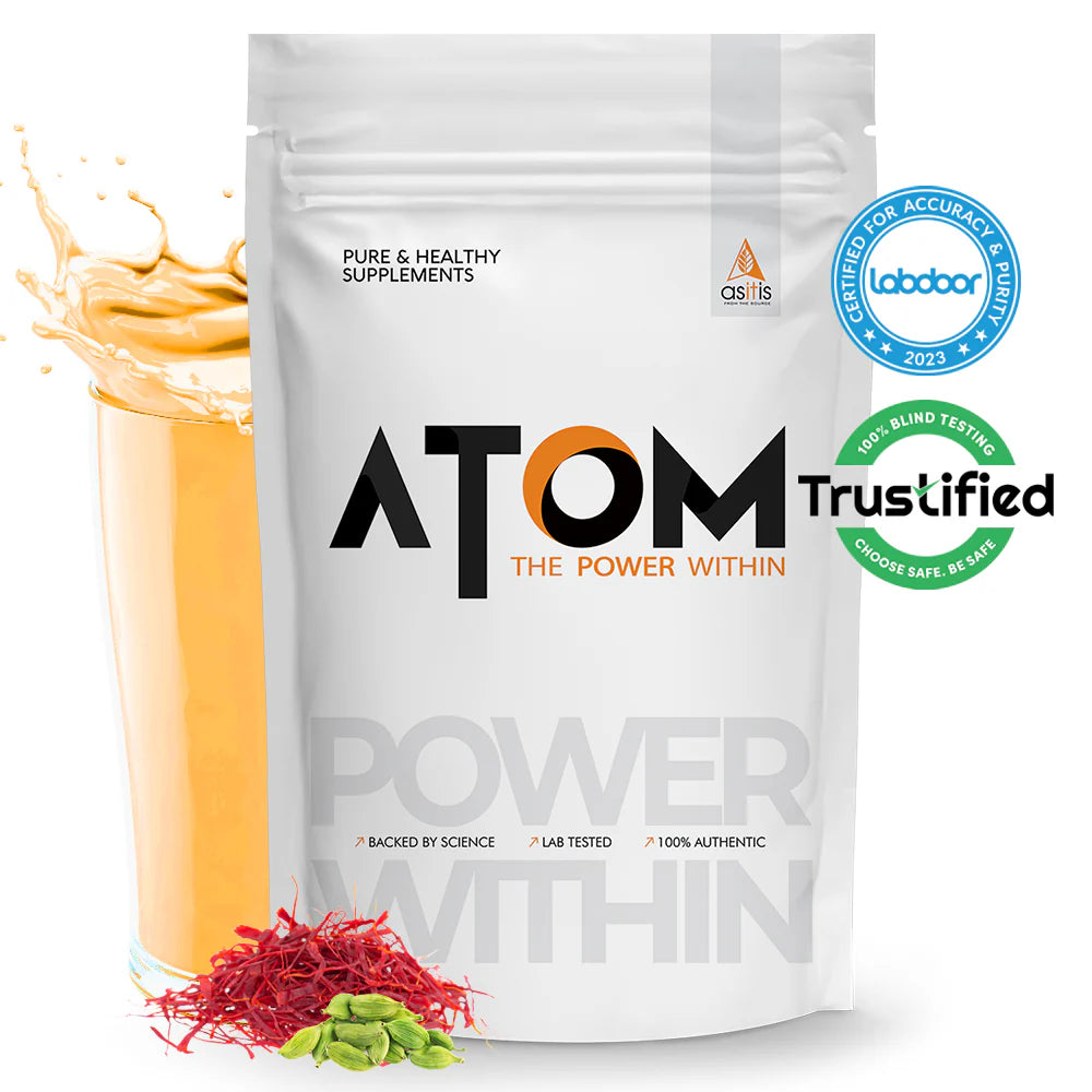 ATOM supplement package with a glass of orange liquid and red and green herbs on a white background