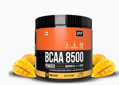 QNT BCAA 8500 powder container with mangoes on a white background
