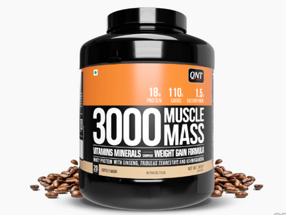 Black supplement bottle labeled '3000 Muscle Mass' with coffee beans on a white background