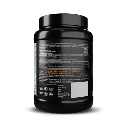 Black supplement container with label on a black background