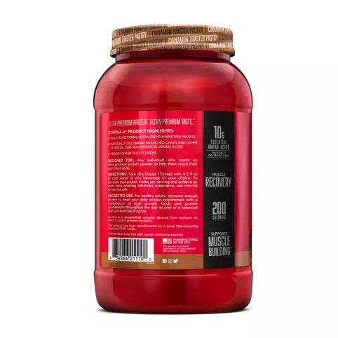 Red supplement container with a wooden cap on a white background